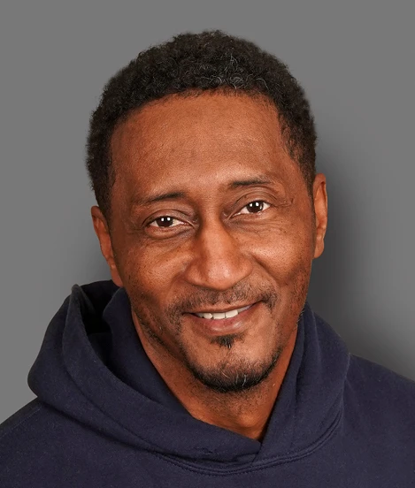 Professional photo of Rock Roseman on a gray background