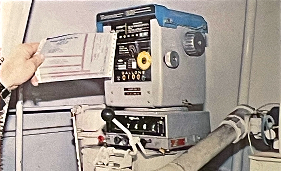 Vintage Lockheed ticket printer mounted inside a Propst Brothers home heating oil delivery truck.