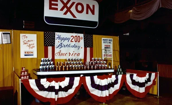 1976 Propst Brothers Exxon display at the Cabarrus County Fair decorated with patriotic red, white, and blue Bicentennial banners.